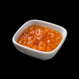 Homemade apricot preserve with honey and clotted cream